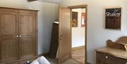 Wardrobe and decor in a bedroom at The Barn at Linden Farm House in Langwathby, Cumbria