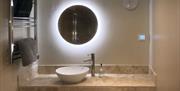 Backlit mirror at The Barn at Linden Farm House in Langwathby, Cumbria