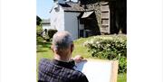 Visitor Sketching in Nature at an Art Course with Long House Studios in Kentmere, Lake District