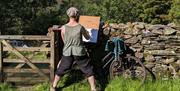 Visitor Sketching in Nature at an Art Course with Long House Studios in Kentmere, Lake District