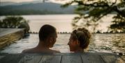 Couple in Infinity Pool at The Spa at Low Wood Bay Resort in Windermere, Lake District
