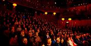 Visitors Watching a Performance at Theatre by the Lake in Keswick, Lake District