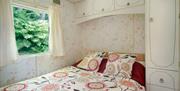 Double bed at Retro Caravan in Manesty, Lake District