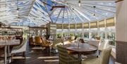 Dining Tables and Seating at The Conservatory at The Melbreak Hotel in Great Clifton, Cumbria