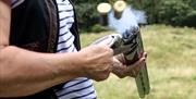 Visitor at Target Practice with Michael Coates Clay Shooting in the Lake District, Cumbria