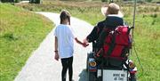 Family Using a Tramper Hired from Outdoor Mobility in the Lake District, Cumbria