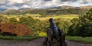 Cannon overlooking a scenic view at Muncaster Castle & Gardens in Ravenglass, Cumbria