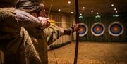 Archery at the Weapons Hall at Muncaster Castle & Gardens in Ravenglass, Cumbria