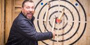 Axe Throwing at the Weapons Hall at Muncaster Castle & Gardens in Ravenglass, Cumbria