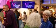 Visitors gathering inside at The Victoria Wood Theatre in Bowness-on-Windermere, Lake District