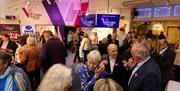 Visitors gathering inside at The Victoria Wood Theatre in Bowness-on-Windermere, Lake District