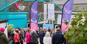 Visitors gathering at the entrance to The Victoria Wood Theatre in Bowness-on-Windermere, Lake District