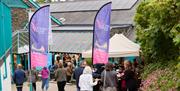Visitors gathering at the entrance to The Victoria Wood Theatre in Bowness-on-Windermere, Lake District