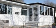 Exterior of the Woodlands Chalet at The Netherwood Hotel & Spa in Grange-over-Sands, Cumbria