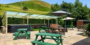 Outside seating at Howgills Barn in Sedbergh, Cumbria