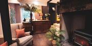 Fireplace and lounge area at Plato's in Kirkby Lonsdale, Cumbria