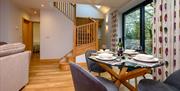 Dining Area and Stairs at Moor View Cottage at Park Cliffe Camping & Caravan Estate near Windermere, Lake District