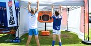 Children playing games at an event held by BarrowFull in Barrow-in-Furness, Cumbria