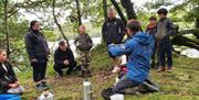 Visitors on a Canoe and Bushcraft Experience with Path to Adventure in the Lake District, Cumbria