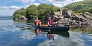 Visitors on a Canoe and Bushcraft Experience with Path to Adventure in the Lake District, Cumbria