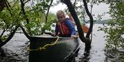 Visitors on a Canoe and Bushcraft Experience with Path to Adventure in the Lake District, Cumbria