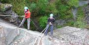 Visitors Abseiling with Path to Adventure in the Lake District, Cumbria