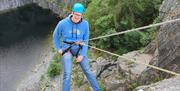 Visitor Abseiling with Path to Adventure in the Lake District, Cumbria