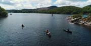 Visitors on a Guided Canoe Trip with Path to Adventure in Coniston, Lake District