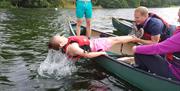 Visitors on a Guided Canoe Trip with Path to Adventure in Coniston, Lake District