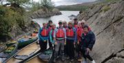 Visitors on a Guided Canoe Trip with Path to Adventure in Coniston, Lake District