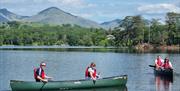 Visitors on a Guided Canoe Trip with Path to Adventure in Coniston, Lake District