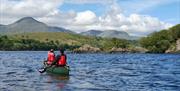 Visitors on a Guided Canoe Trip with Path to Adventure in Coniston, Lake District