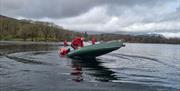 Visitors on a Guided Canoe Trip with Path to Adventure in Coniston, Lake District