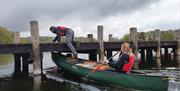 Visitors on a Guided Canoe Trip with Path to Adventure in Coniston, Lake District