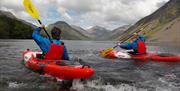 Visitors Kayaking in the Lake District with Path to Adventure