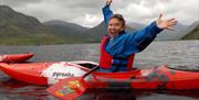 Visitors Kayaking in the Lake District with Path to Adventure