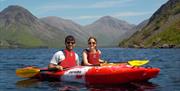 Visitors Kayaking in the Lake District with Path to Adventure