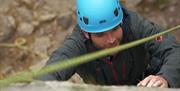 Visitor Rock Climbing with Path to Adventure in the Lake District, Cumbria