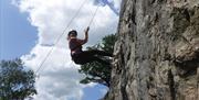 Visitor Rock Climbing with Path to Adventure in the Lake District, Cumbria