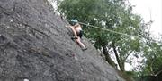 Visitor Rock Climbing with Path to Adventure in the Lake District, Cumbria