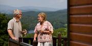 Couple at a Holiday Home at Park Cliffe Camping & Caravan Estate in Windermere, Lake District