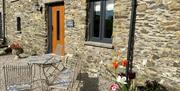 Exterior and patio seating at Patton Hall Farm Country Cottages near Kendal, Cumbria