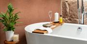 Tray for Bathtub with Wine and Books at The Pele Tower, Killington Hall near Kirkby Lonsdale, Cumbria