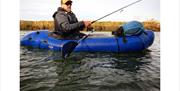 Customer fishing from a kayak using a Rigged and Ready fishing rod