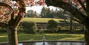 Fountain and Blossoming Trees at Farlam Hall Hotel near Brampton, Cumbria