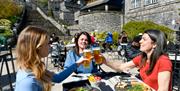 Visitors Enjoying Outdoor Dining at Brewery Arts Centre in Kendal, Cumbria