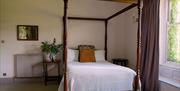 Bedroom with four poster bed at Rothay Garth B&B in Ambleside, Lake District