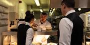 Staff serving food at Rothay Garden Restaurant by Harbour Hotels in Grasmere, Lake District