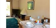 Dining room and lounge at The Saplings in Bothel, Cumbria