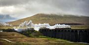 Steam Train on The Settle - Carlisle Railway line in Cumbria, UK